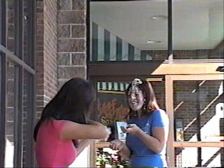 Two girls pie each other