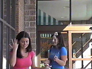 Two girls pie each other