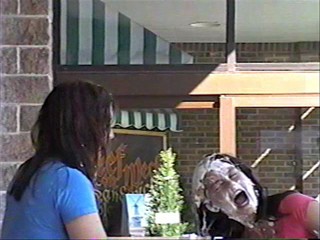 Two girls pie each other