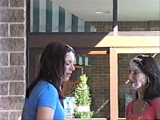 Two girls pie each other