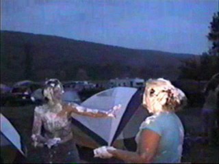 Two girls shaving cream pie fight part II
