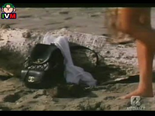 Anna Falchi wading into sea