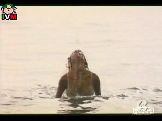 Anna Falchi wading into sea