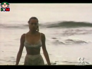 Anna Falchi wading into sea