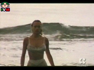 Anna Falchi wading into sea