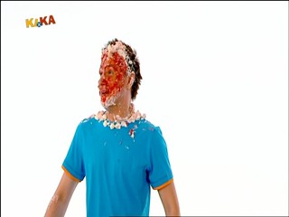 Male presenter caked