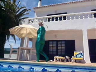 Wetlook Milf swimming in Shiny catsuit