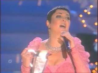 Singer Pours Water On Herself