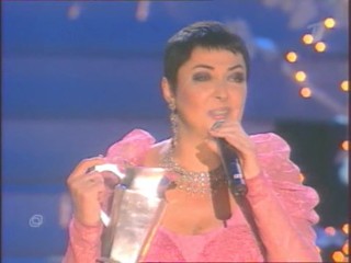 Singer Pours Water On Herself