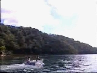 girl jumps from boat in jeans
