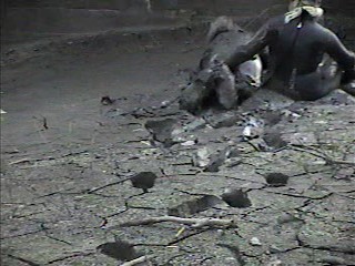 Rubber wetsuits in mud