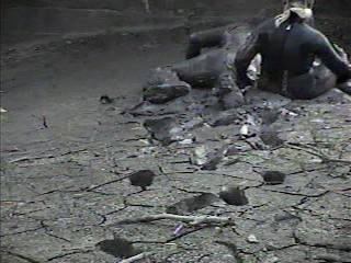 Rubber wetsuits in mud