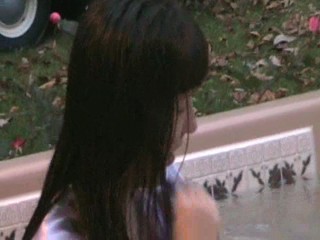 Jennifer in the hottub in her nightgown