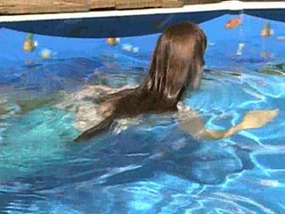 Clips from Jennifer's long aqua skirt video