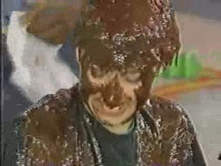 A women has chocolate poured over her head