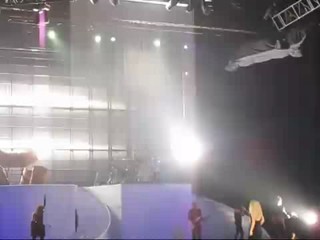 Taylor Swift performing in rain