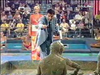 Mud wrestling (2 girls against 1 guy)