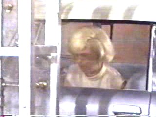 woman goes through car wash