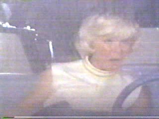 woman goes through car wash