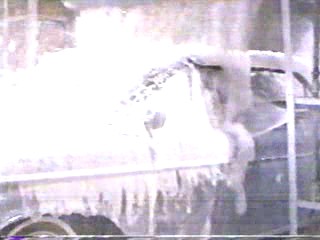 woman goes through car wash