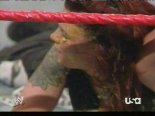 wwe:- Lita sprayed in the face with mustard