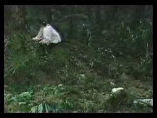 girl in wedding dress in bog